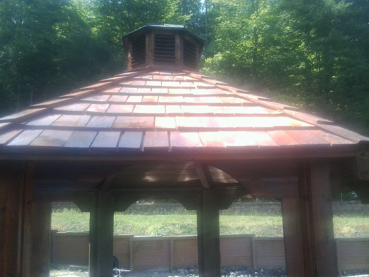 New cedar shake roof and cupola on a lakeside gazebo in Grove City